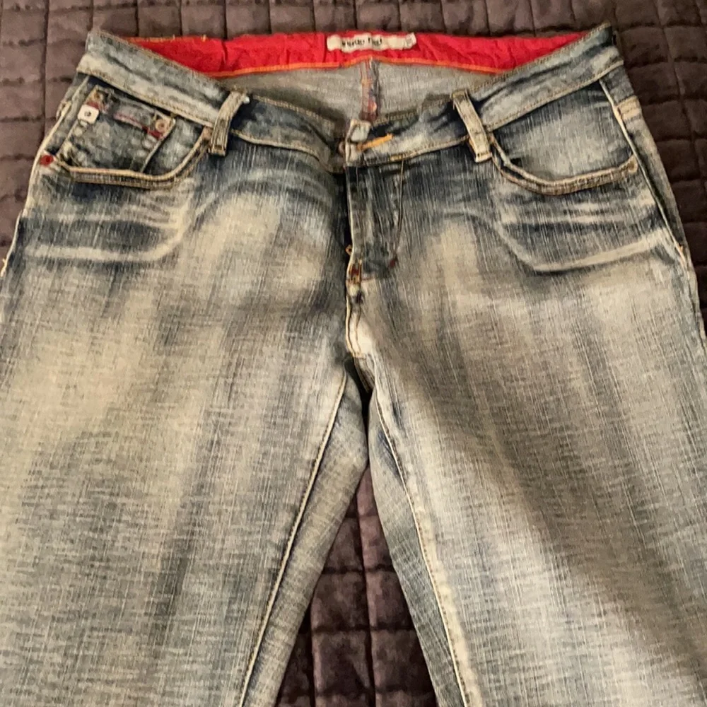 Indigo red washed‎ faded bootcut jeans